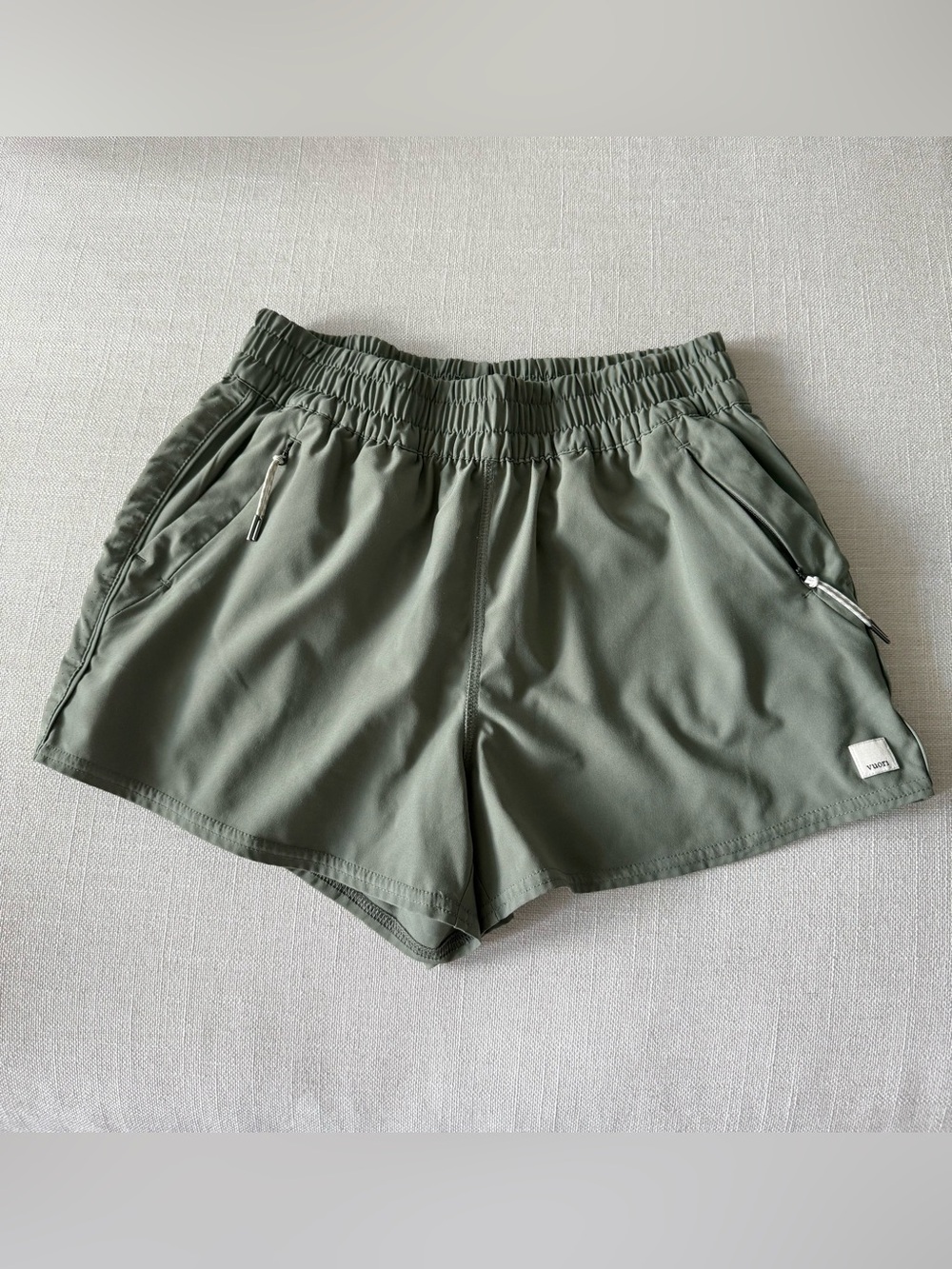 Vuori Olive Athletic Shorts with Elastic Waist and Zip Pockets